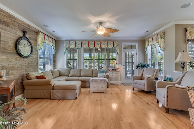 kitchen featuring crown molding, a breakfast bar area, appliances with stainless steel finishes, and decorative backsplash