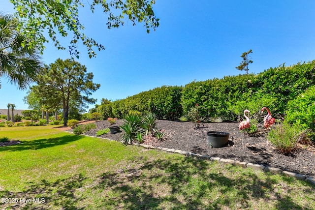 exterior space featuring a front yard, brick siding, and a shingled roof