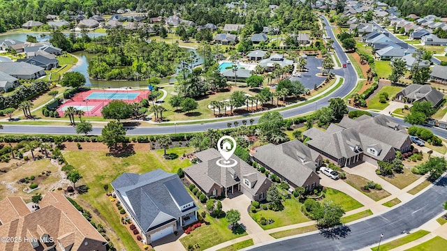 aerial view featuring a water view and a residential view