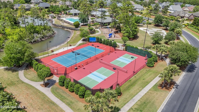 drone / aerial view featuring a water view and a residential view
