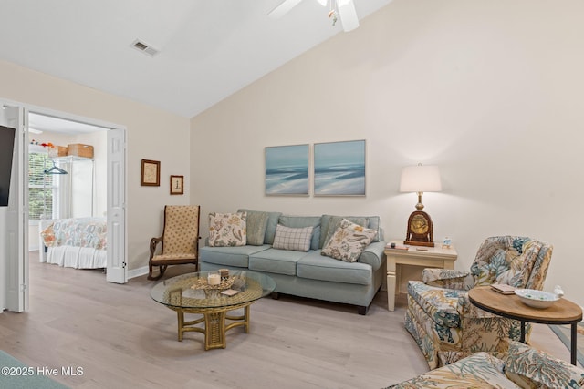 404 Sunset Oaks Ln, Sunset Beach, NC 28468 - living area with light wood finished floors, ceiling fan, high vaulted ceiling, and baseboards