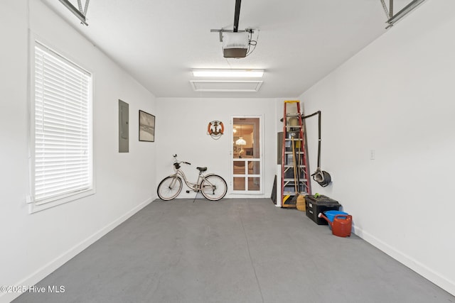 404 Sunset Oaks Ln, Sunset Beach, NC 28468 - garage with electric panel, a garage door opener, and baseboards