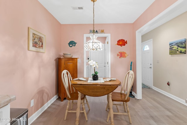 404 Sunset Oaks Ln, Sunset Beach, NC 28468 - dining space featuring light wood-type flooring and baseboards