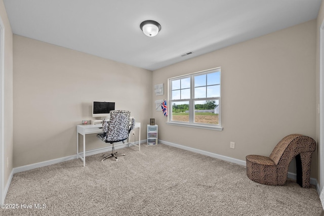 office area with carpet floors, baseboards, and visible vents