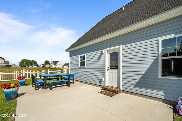 view of patio / terrace featuring fence