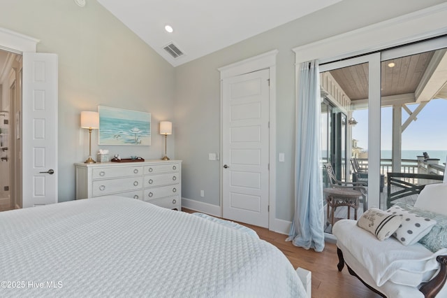 26 Seagull St Unit B, Wrightsville Beach, NC 28480 - bedroom with access to outside, wood finished floors, lofted ceiling, baseboards, and a water view