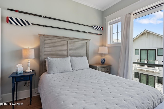 26 Seagull St Unit B, Wrightsville Beach, NC 28480 - bedroom with crown molding, wood finished floors, and baseboards