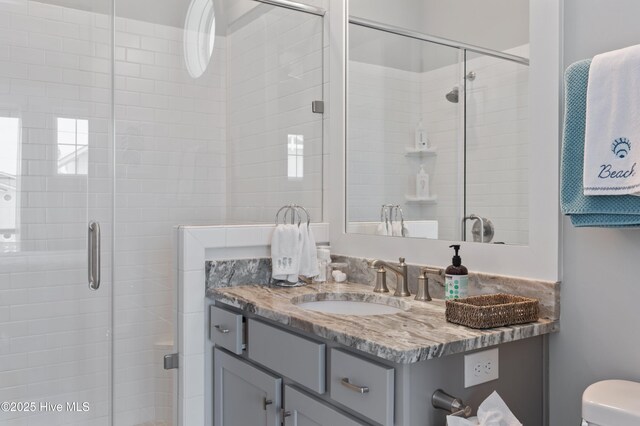 26 Seagull St Unit B, Wrightsville Beach, NC 28480 - full bathroom with a stall shower, vanity, and toilet