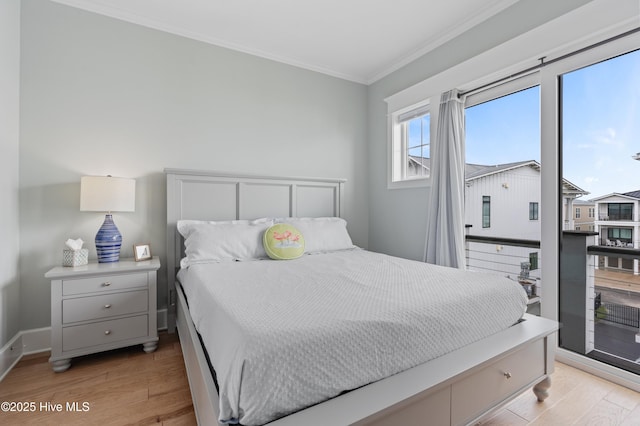 26 Seagull St Unit B, Wrightsville Beach, NC 28480 - bedroom featuring light wood-type flooring, ornamental molding, and baseboards