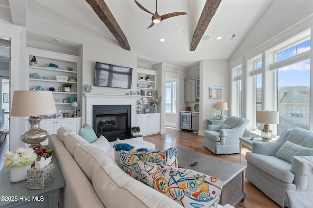 26 Seagull St Unit B, Wrightsville Beach, NC 28480 - living area with beverage cooler, wood finished floors, ceiling fan, a fireplace, and recessed lighting