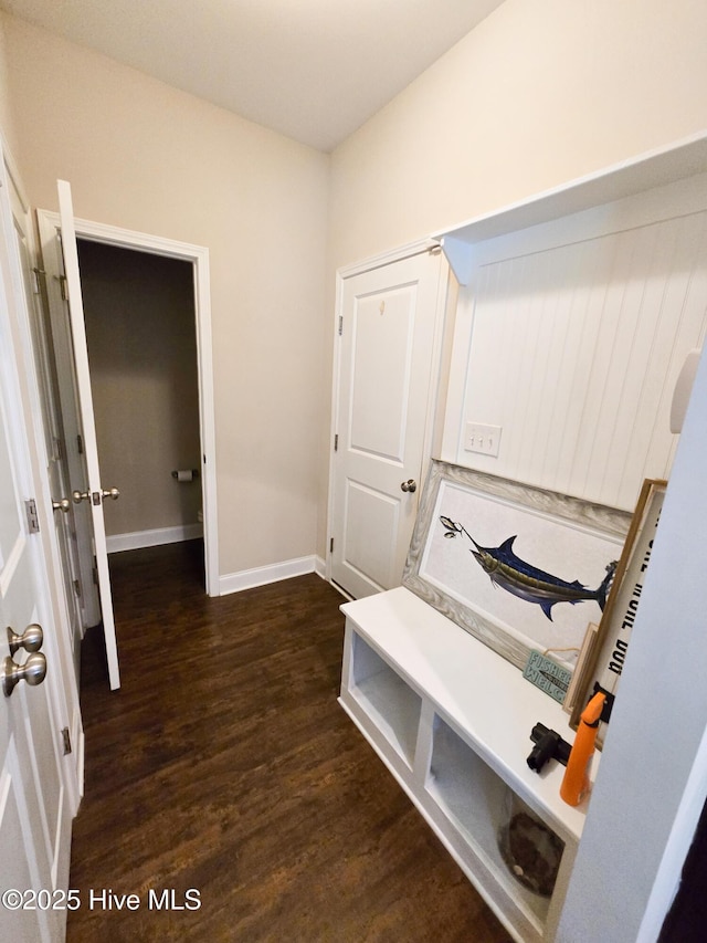 mudroom featuring wood finished floors and baseboards