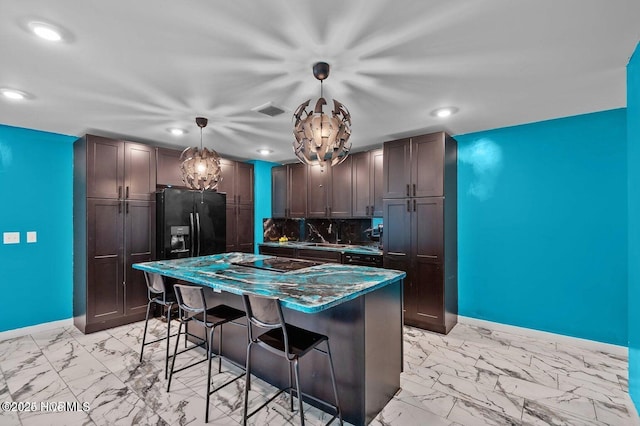 1718 Highland Dr, Washington, NC 27889 - kitchen featuring marble finish floor, black appliances, a breakfast bar area, recessed lighting, and baseboards