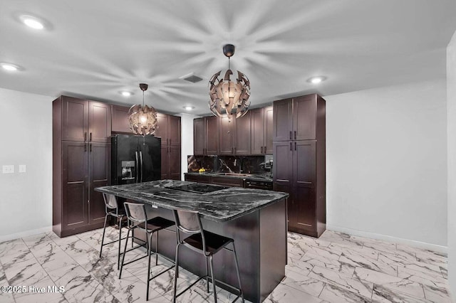 1718 Highland Dr, Washington, NC 27889 - kitchen featuring baseboards, marble finish floor, a kitchen breakfast bar, and recessed lighting