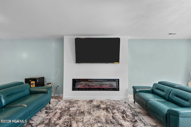 1718 Highland Dr, Washington, NC 27889 - living room featuring marble finish floor, baseboards, a glass covered fireplace, and visible vents