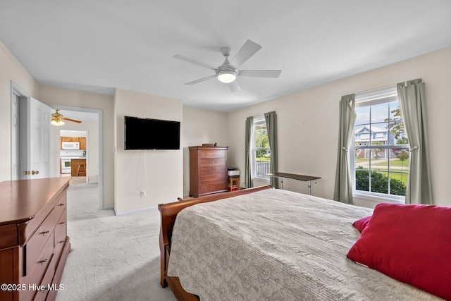 carpeted bedroom featuring ceiling fan and baseboards