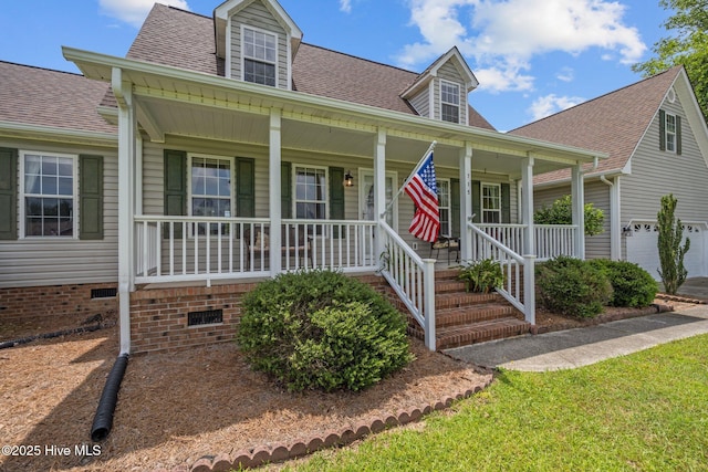 cape cod home with a porch, crawl space, roof with shingles, and a garage