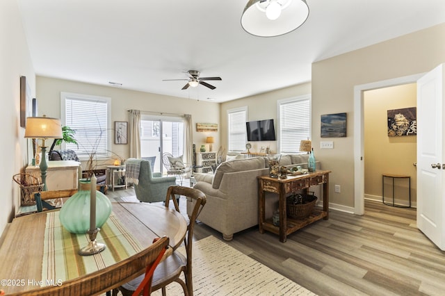 326 Starfish Ln, Sneads Ferry, NC 28460 - living area with baseboards, light wood-style flooring, and ceiling fan