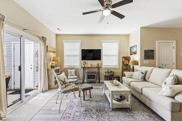 326 Starfish Ln, Sneads Ferry, NC 28460 - living area featuring baseboards, a ceiling fan, visible vents, and wood finished floors
