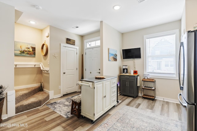 326 Starfish Ln, Sneads Ferry, NC 28460 - kitchen with freestanding refrigerator, recessed lighting, baseboards, light wood finished floors, and white cabinetry
