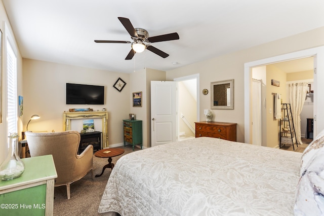 326 Starfish Ln, Sneads Ferry, NC 28460 - bedroom with baseboards, a fireplace, and a ceiling fan