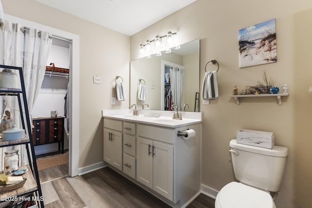 326 Starfish Ln, Sneads Ferry, NC 28460 - full bathroom with a sink, toilet, baseboards, and wood finished floors