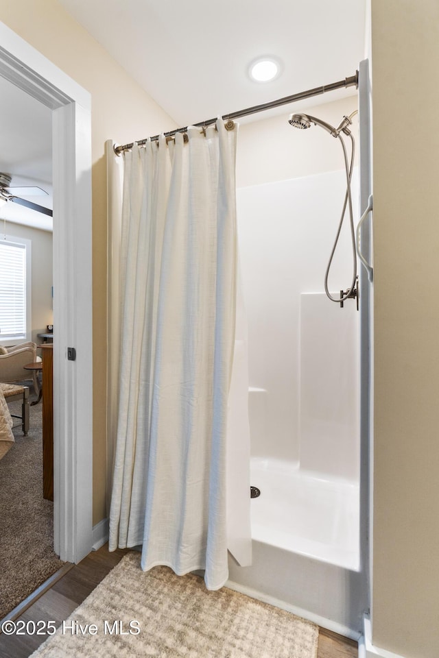 326 Starfish Ln, Sneads Ferry, NC 28460 - bathroom featuring a shower with curtain, a ceiling fan, and wood finished floors