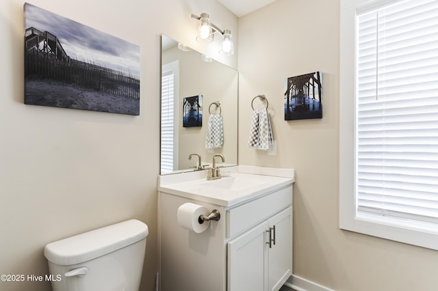 326 Starfish Ln, Sneads Ferry, NC 28460 - bathroom with toilet, baseboards, and vanity