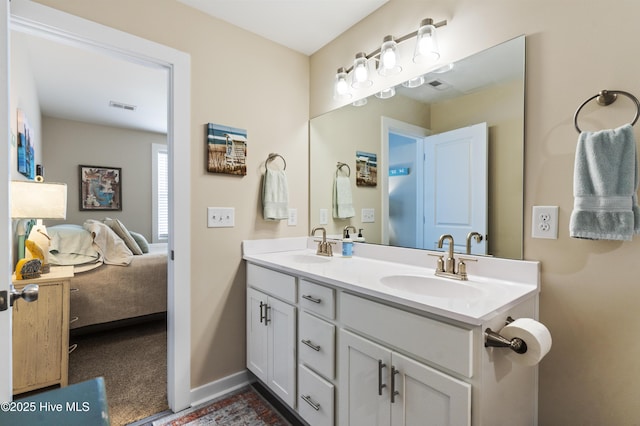 326 Starfish Ln, Sneads Ferry, NC 28460 - bathroom featuring a sink, double vanity, baseboards, and visible vents