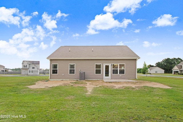 back of property with a lawn