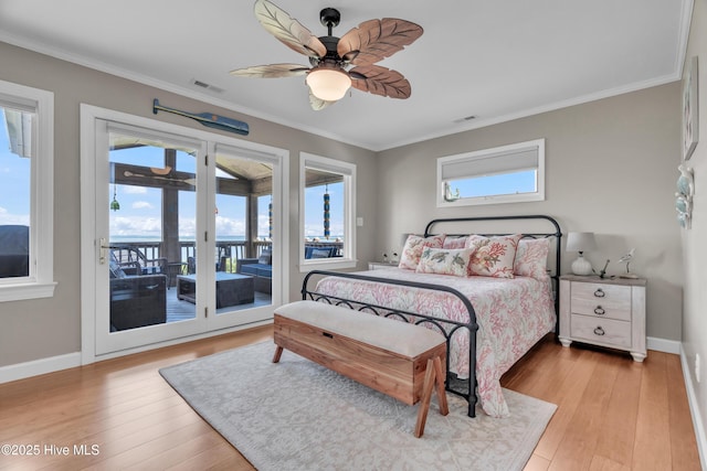 515 Blue Heron Dr, Newport, NC 28570 - bedroom with access to exterior, light wood-style flooring, ornamental molding, and baseboards