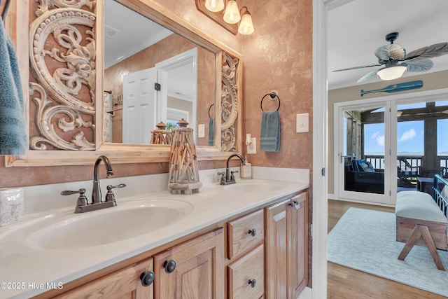 515 Blue Heron Dr, Newport, NC 28570 - bathroom featuring wood finished floors, double vanity, ceiling fan, and ornamental molding