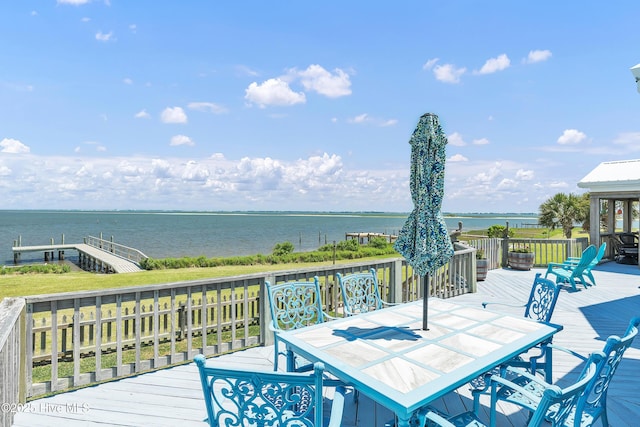 515 Blue Heron Dr, Newport, NC 28570 - wooden terrace featuring outdoor dining space and a water view