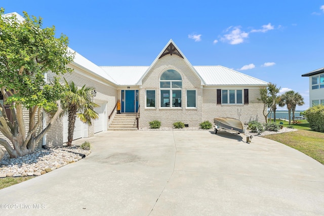 515 Blue Heron Dr, Newport, NC 28570 - ranch-style house featuring brick siding, concrete driveway, a garage, and metal roof