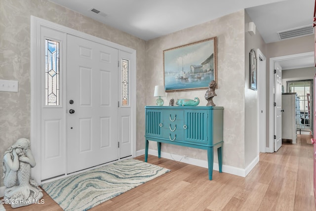 515 Blue Heron Dr, Newport, NC 28570 - entryway with wood finished floors, baseboards, and wallpapered walls
