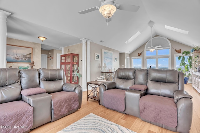 515 Blue Heron Dr, Newport, NC 28570 - living room with ceiling fan, a skylight, vaulted ceiling, wood finished floors, and ornate columns