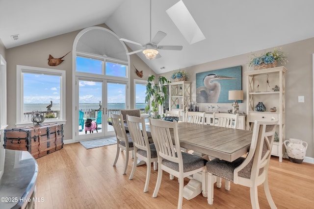 515 Blue Heron Dr, Newport, NC 28570 - dining room with a skylight, light wood-type flooring, healthy amount of natural light, a ceiling fan, and high vaulted ceiling