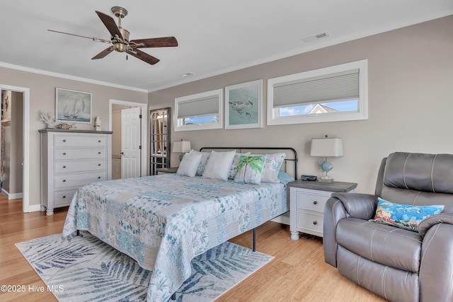 515 Blue Heron Dr, Newport, NC 28570 - bedroom featuring light wood-type flooring, crown molding, ceiling fan, and baseboards