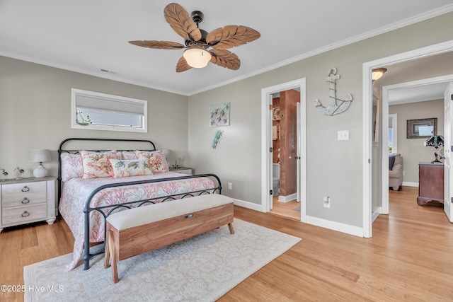 515 Blue Heron Dr, Newport, NC 28570 - bedroom featuring ornamental molding, light wood-style flooring, baseboards, and a ceiling fan