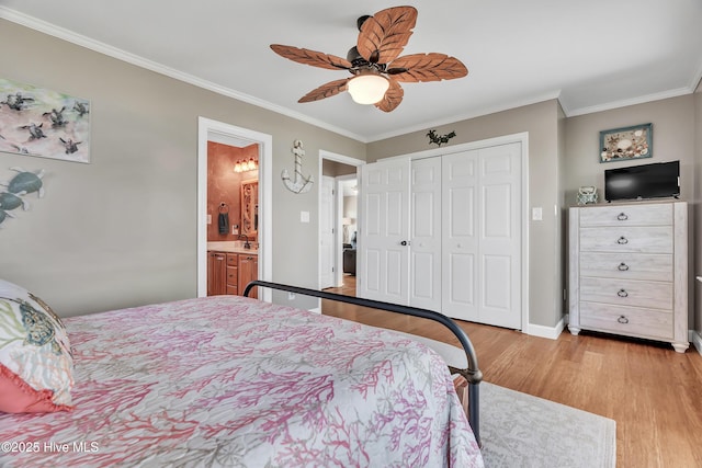 515 Blue Heron Dr, Newport, NC 28570 - bedroom with light wood-type flooring, ornamental molding, a closet, baseboards, and a ceiling fan
