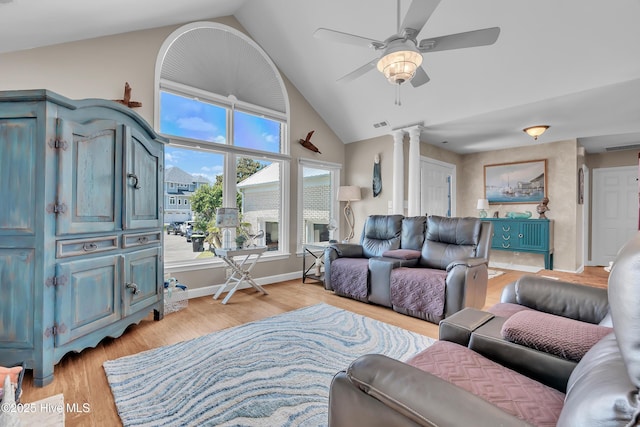 515 Blue Heron Dr, Newport, NC 28570 - living room featuring ornate columns, light wood-type flooring, a ceiling fan, baseboards, and high vaulted ceiling