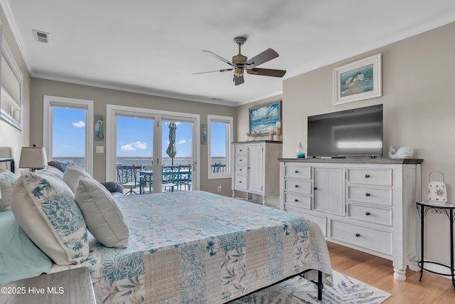 515 Blue Heron Dr, Newport, NC 28570 - bedroom with access to outside, light wood-type flooring, crown molding, and ceiling fan