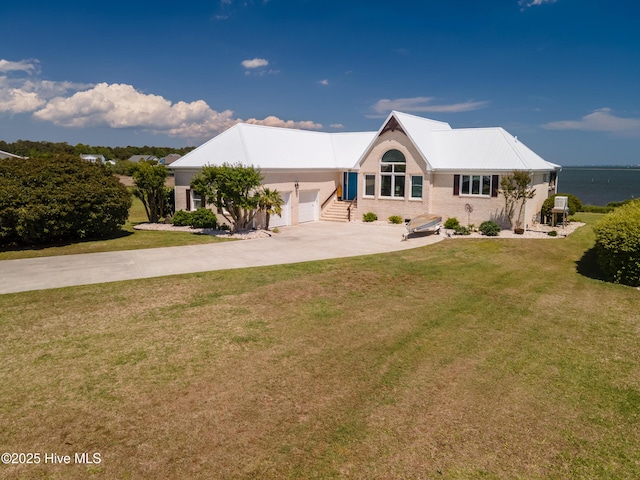 515 Blue Heron Dr, Newport, NC 28570 - view of front of property with a garage, driveway, a front yard, and brick siding