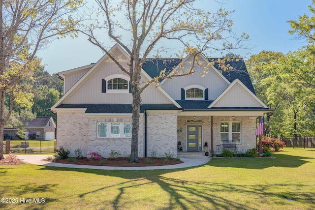 237 Pine Village Dr, Rocky Point, NC 28457 - view of front of property featuring brick siding and a porch