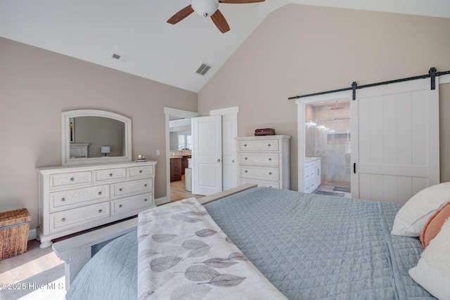 237 Pine Village Dr, Rocky Point, NC 28457 - bedroom with ensuite bathroom, high vaulted ceiling, a barn door, and ceiling fan