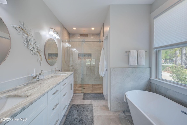 237 Pine Village Dr, Rocky Point, NC 28457 - bathroom featuring a soaking tub, a stall shower, double vanity, tile patterned flooring, and recessed lighting