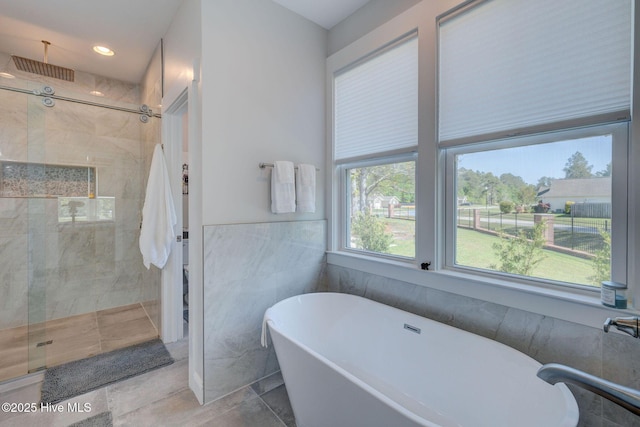 237 Pine Village Dr, Rocky Point, NC 28457 - bathroom featuring a freestanding tub, a stall shower, and recessed lighting