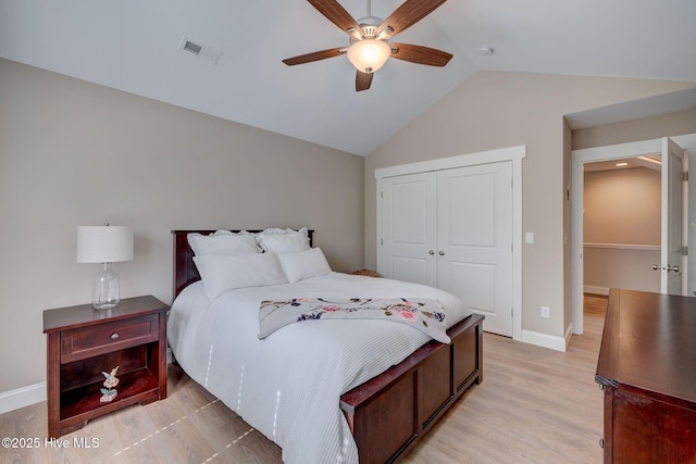 237 Pine Village Dr, Rocky Point, NC 28457 - bedroom featuring lofted ceiling, a closet, light wood-style flooring, and a ceiling fan