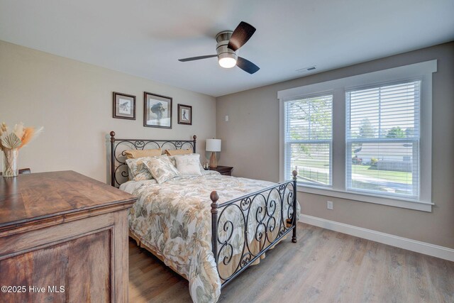 237 Pine Village Dr, Rocky Point, NC 28457 - bedroom with wood finished floors and ceiling fan