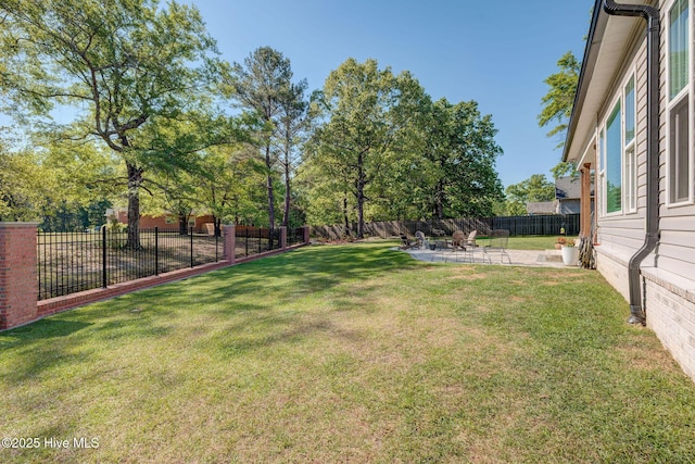 237 Pine Village Dr, Rocky Point, NC 28457 - fenced backyard featuring a patio area