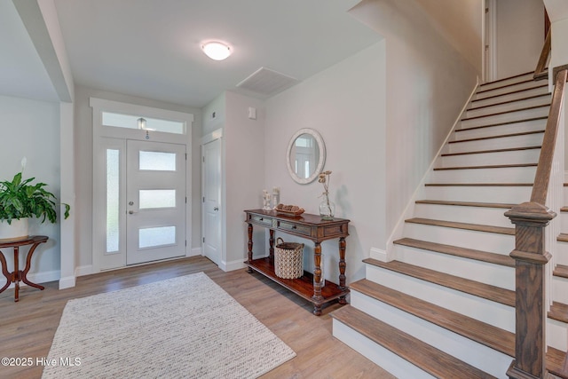 237 Pine Village Dr, Rocky Point, NC 28457 - entryway with stairs and light wood finished floors
